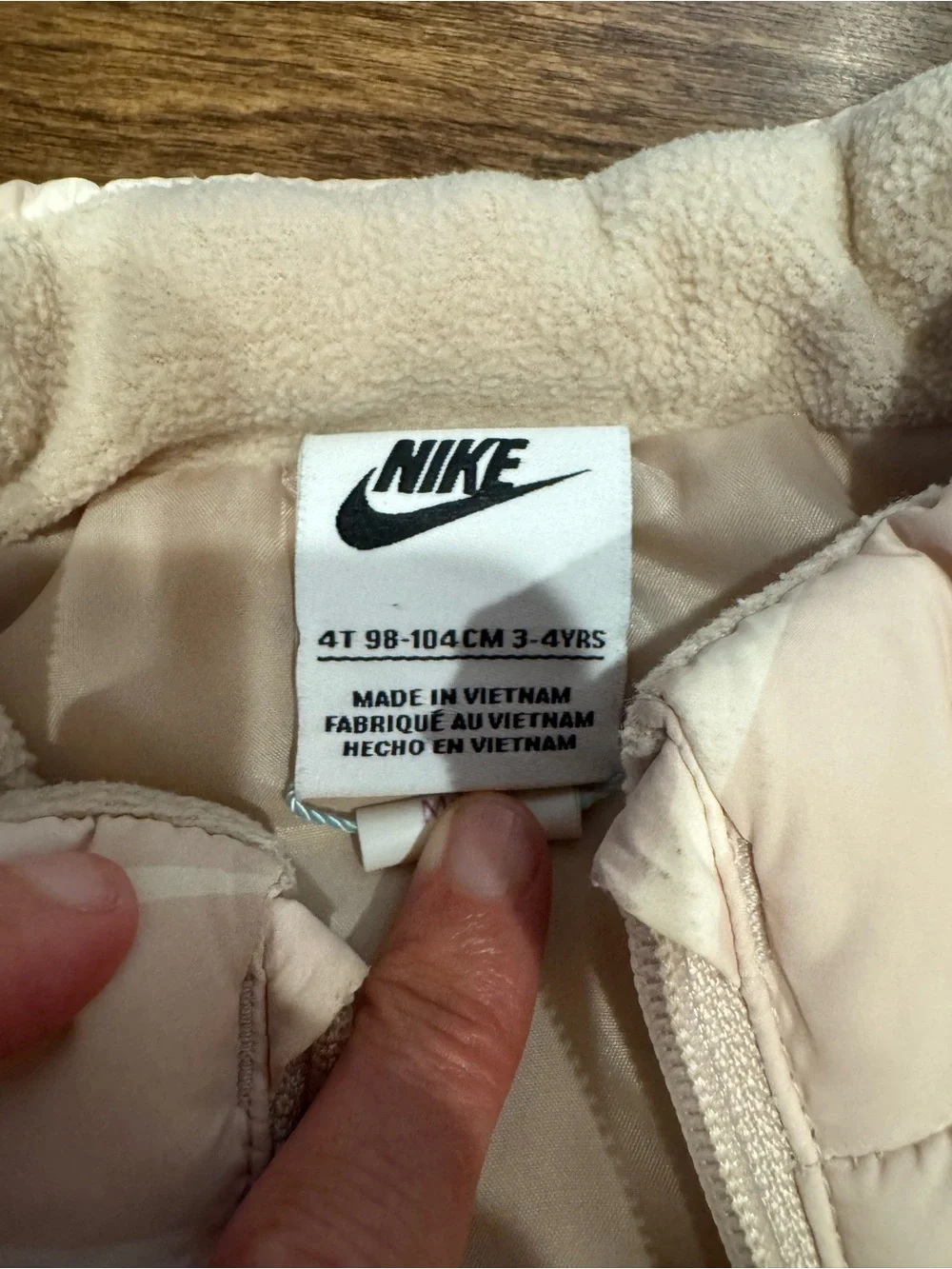 Nike Kids Light Pink Puffer Vest with White Swoosh Pattern